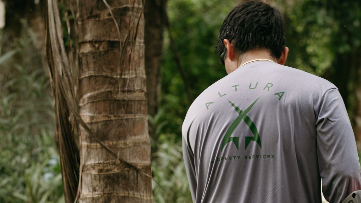Back of an Altura Property Services work shirt with the company logo